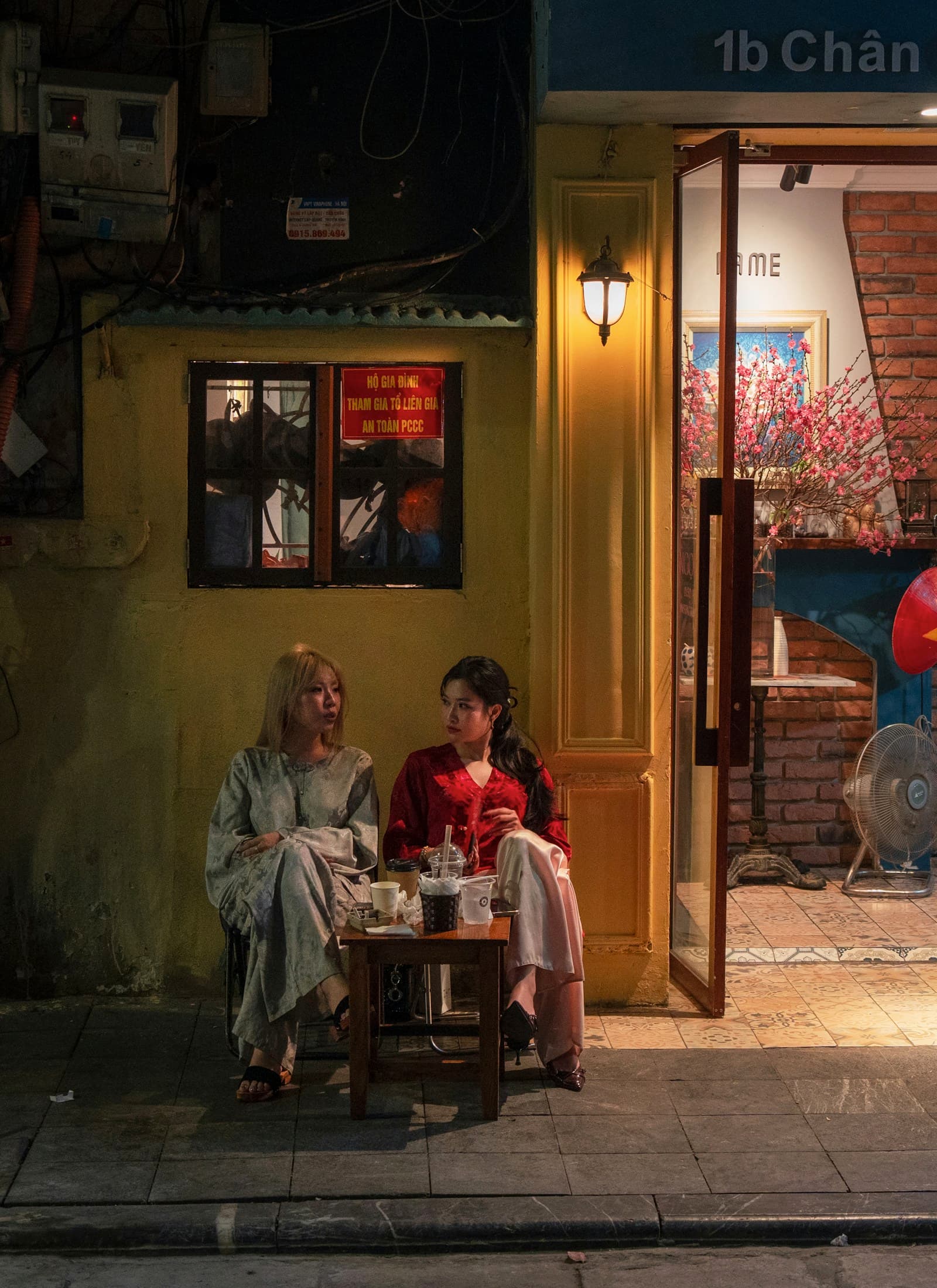 Two women talking outside a cafe
