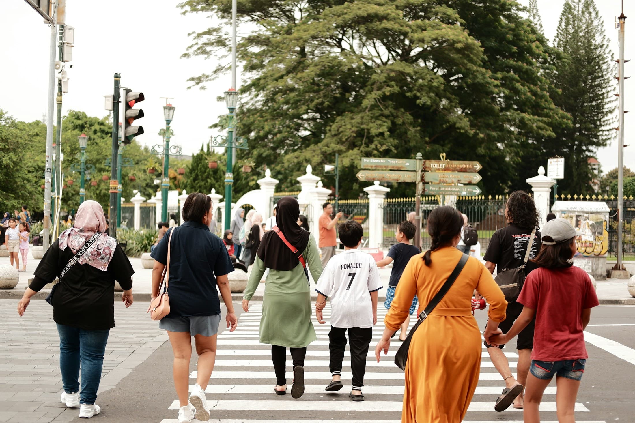 Stylish group of friends crossing a city street