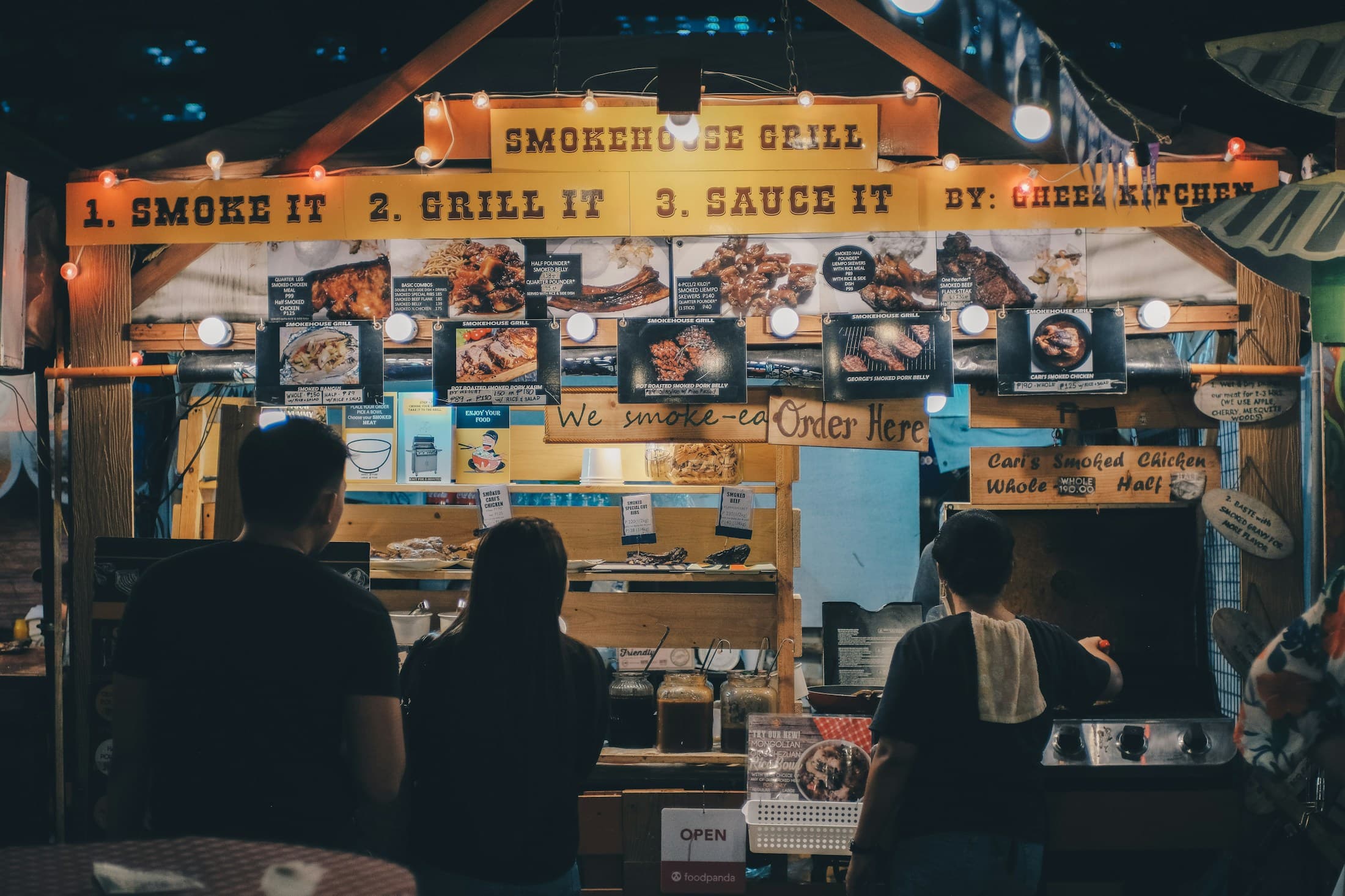 Friends gathering around a lively street food stand