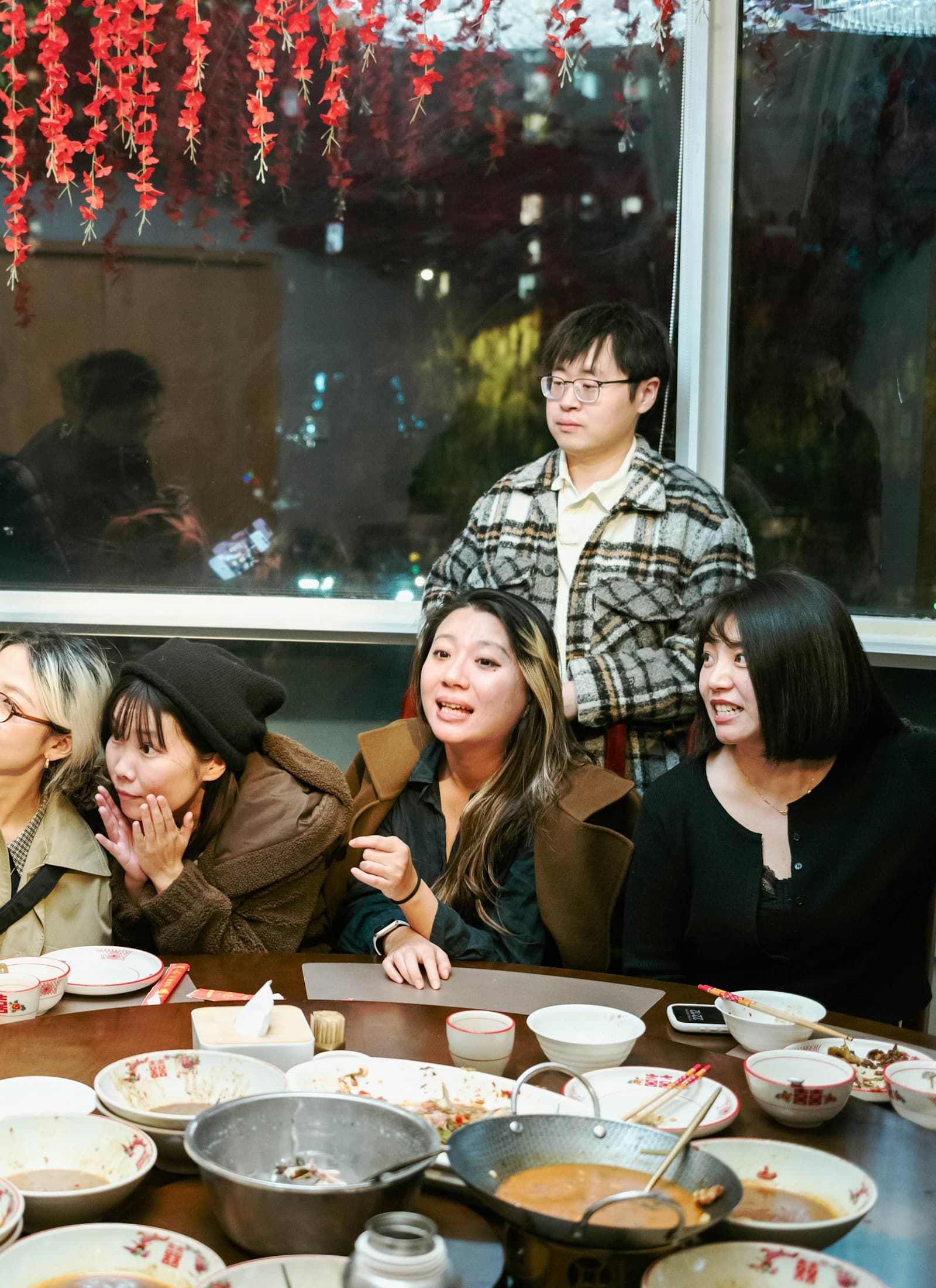 Friends gathered around a dinner table
